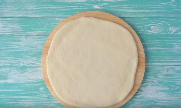 Roll out the dough with a rolling pin.