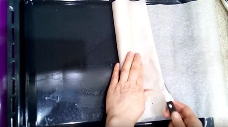 Cover the baking sheet with parchment.