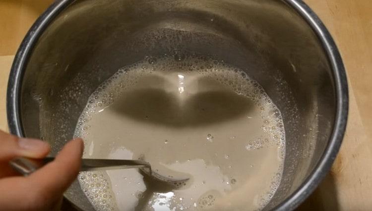 Add water to the leaven, mix