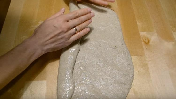 Gently twist the dough into a roll, pinch the edges.