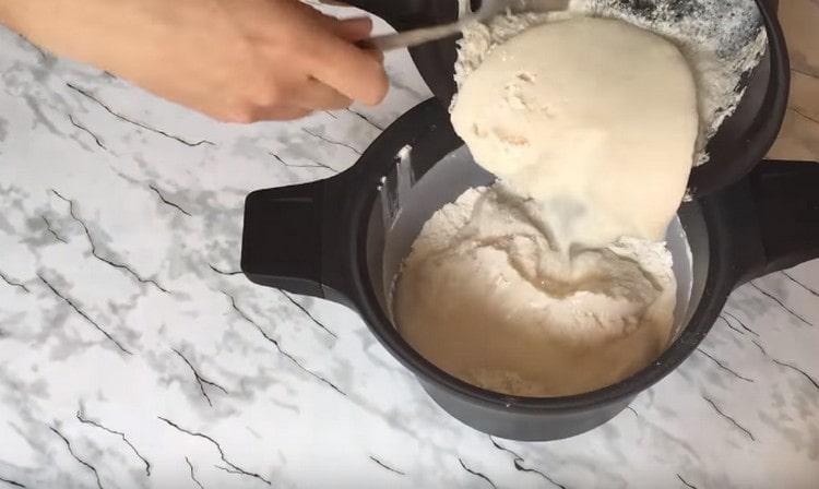 Pour into the flour rising dough.