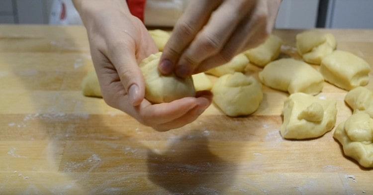 We roll each piece of dough into a ball.