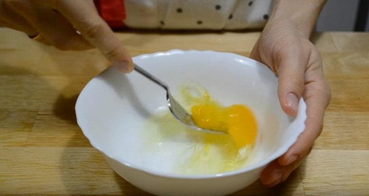 Beat the egg with a fork.