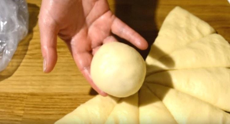 Roll out a ball from each piece of dough.