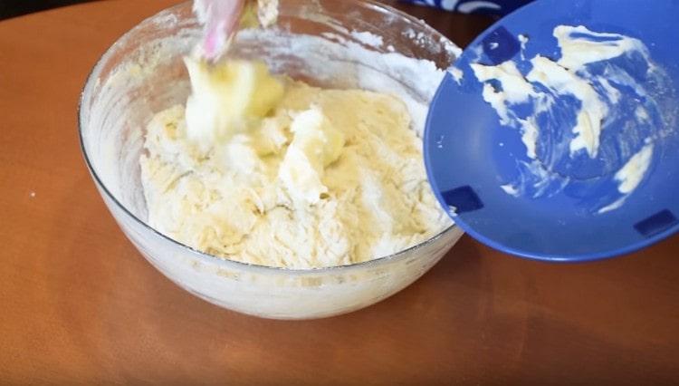 In the process of kneading the dough, we introduce butter into it.