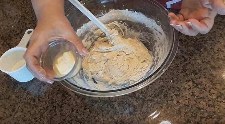 Add melted butter to the dough.