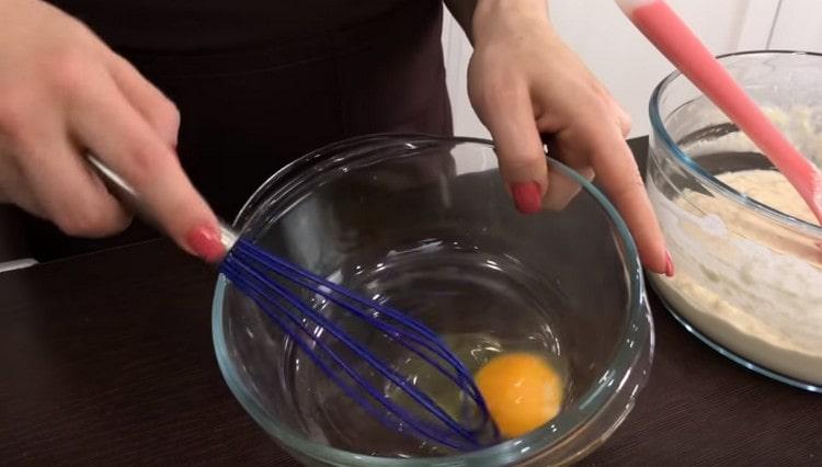 Separately, beat the egg with a whisk.