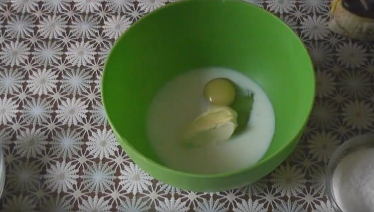 In a separate large bowl, combine the remaining milk, egg and butter.
