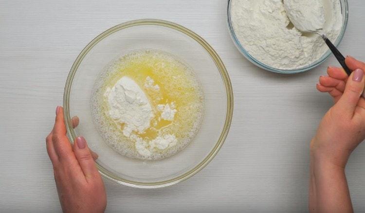 After mixing the egg with water, we start adding flour to this mixture.