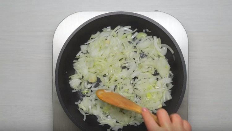 Chop the onion and set it to fry in a pan.