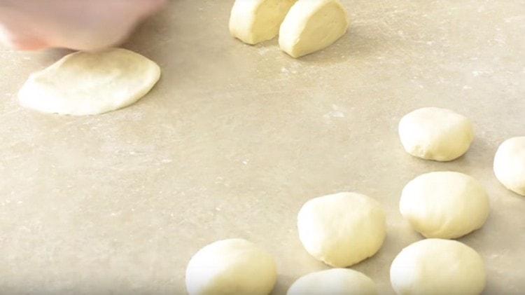 We roll each piece of dough into a ball.