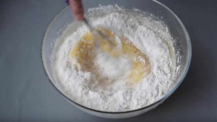 Add the flour and mix the dough.