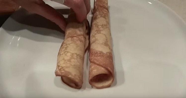 We twist the hot wafer into a tube.