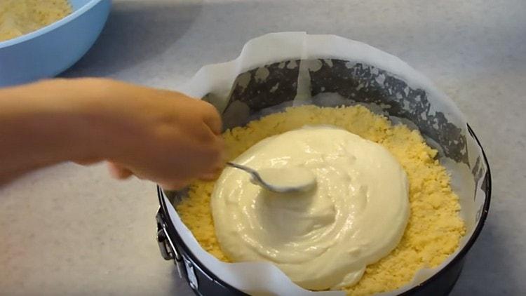 We spread half of the curd filling on top of the dough layer.