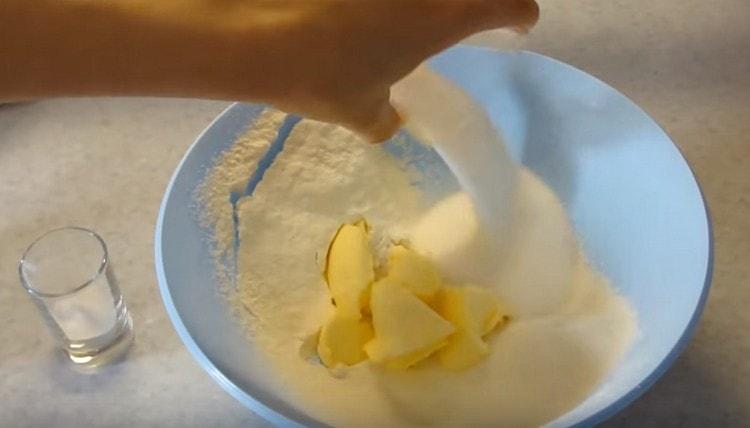 Add butter and sugar to the flour.