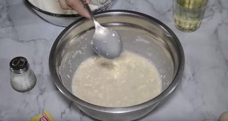 After adding the flour, mix the dough.