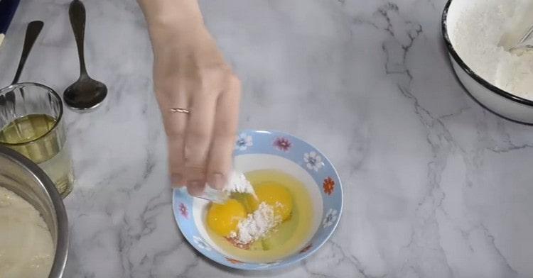 In a separate bowl, mix the eggs with salt.