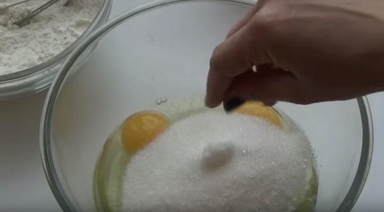 Add salt and sugar to the eggs.