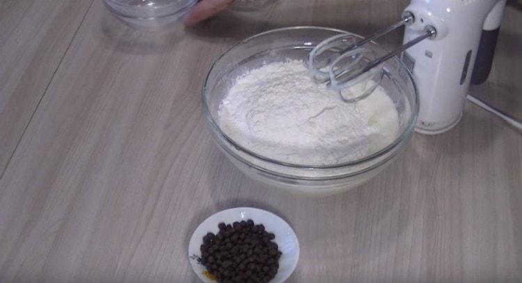 Add starch, baking powder and flour to the liquid components.
