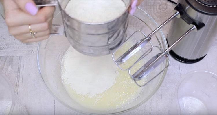 Combine flour with baking powder and sift.