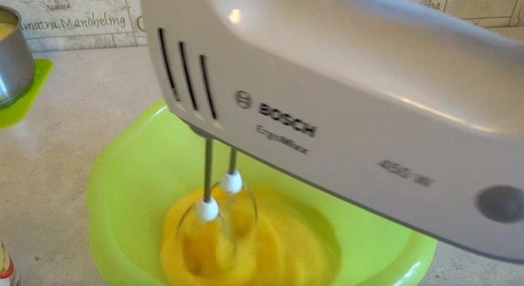 Beat the eggs with a mixer.