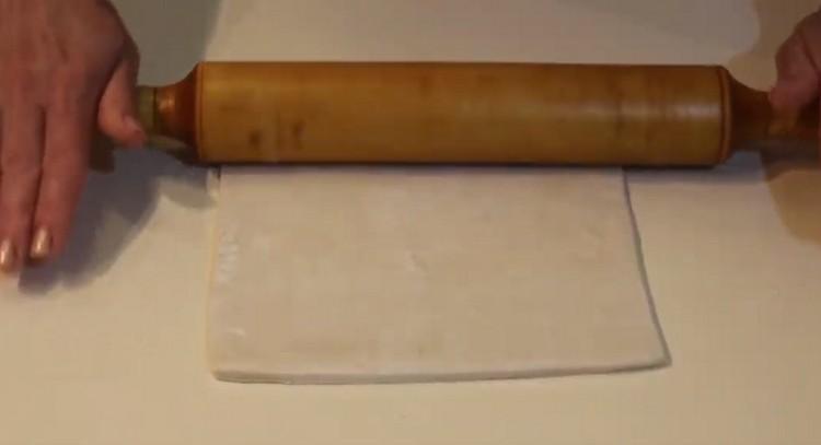 Roll out the dough a little with a rolling pin.