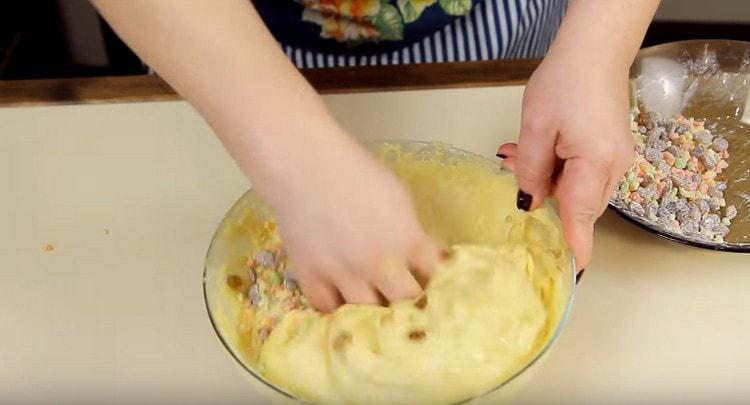 We mix candied fruit into the dough.