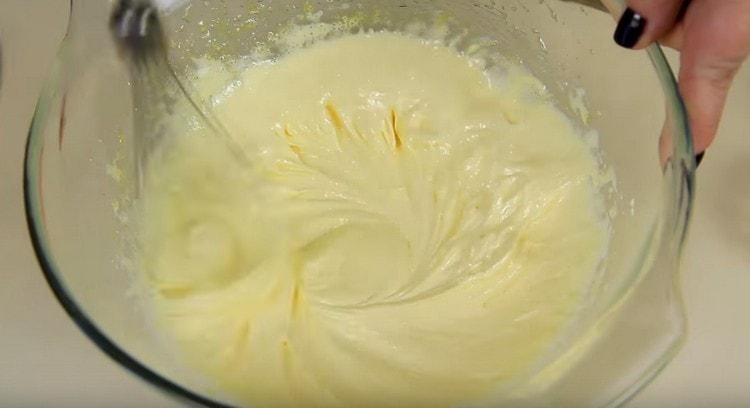 Beat the egg yolks with sugar with a mixer.