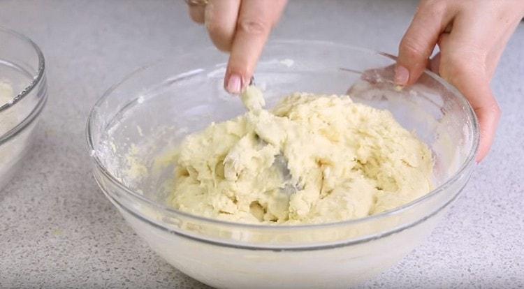 Adding flour, we begin to knead the dough.