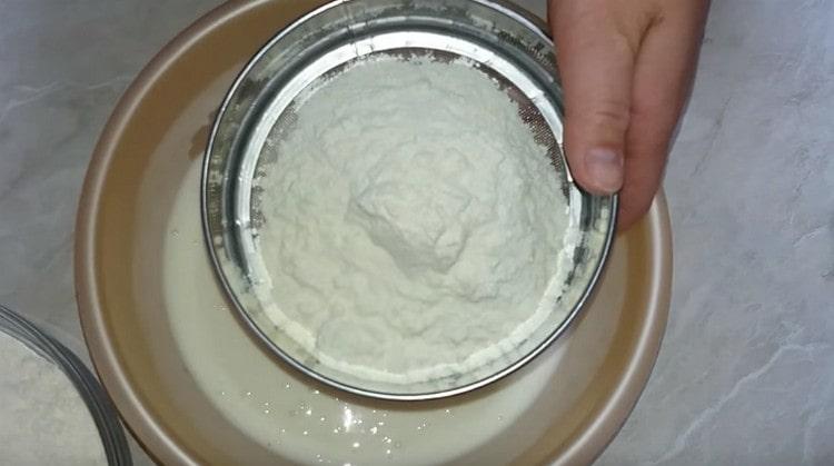 Sift flour into the liquid components.