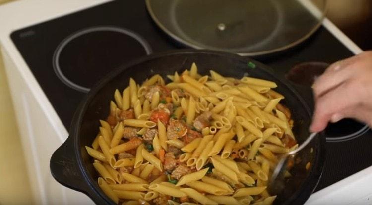 Add the pasta to the pan, mix.