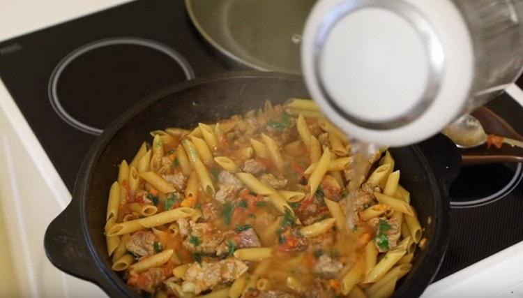 Add water to cook pasta in sauce.