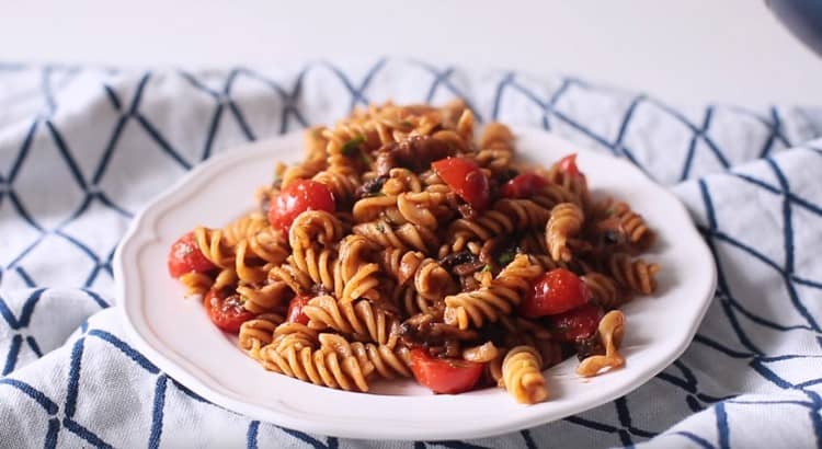 Appetizing pasta with mushrooms ready.