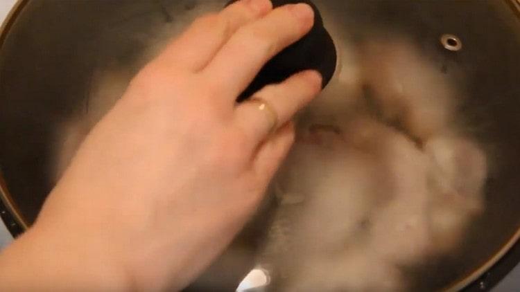 Cooking fish offal under the lid.