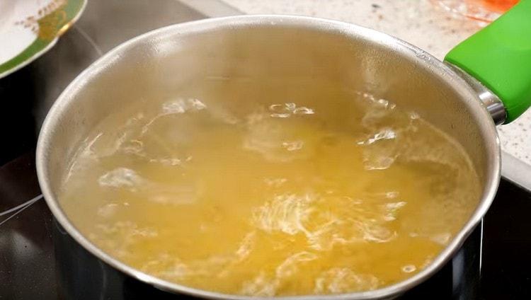 Put the pasta in salted water and cook.