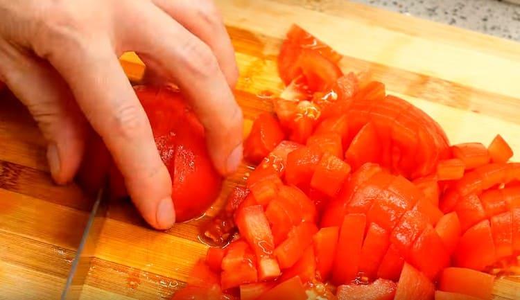 Dice peeled tomatoes.