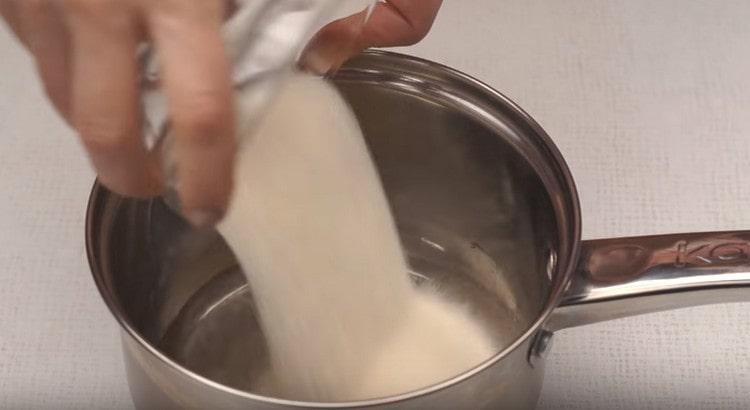 Pour sugar into the stewpan, add water and lemon juice.