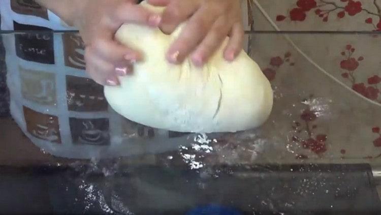 Knead the dough on a work surface.