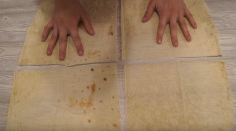 We cut large thin pita bread into 4 parts.