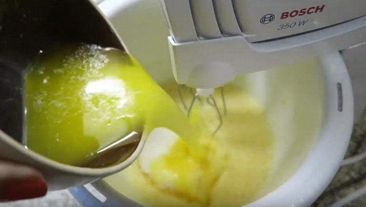 Beat the eggs with a mixer, add salt, sugar, melted butter.