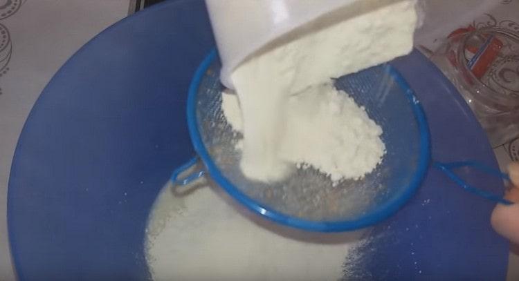 Sift flour into the mass.