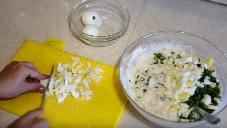 We cut hard-boiled eggs and also add to the dough.