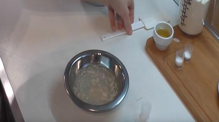Dissolve the yeast in warm water.