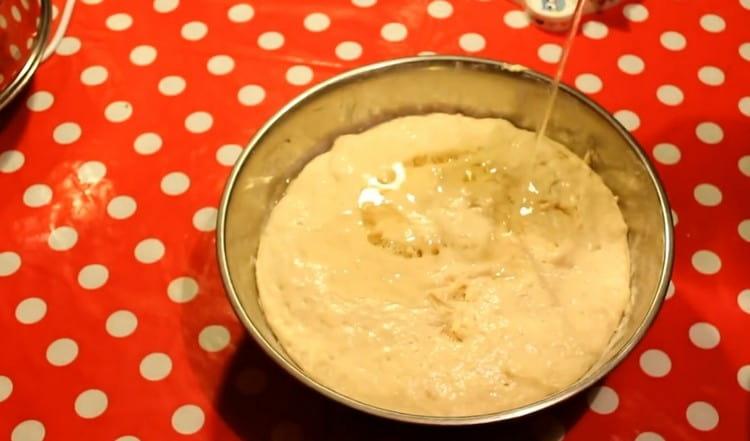 Add vegetable oil to the sticky dough.