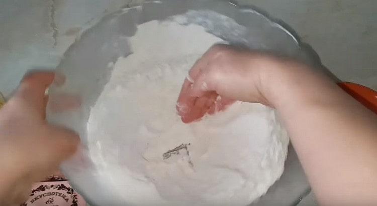 Sift the flour into a bowl and make a depression in it.