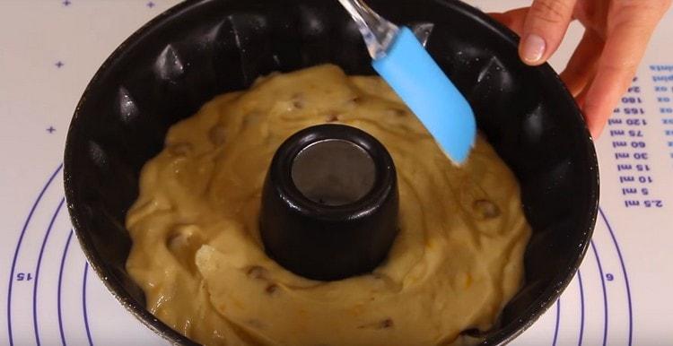 We spread the dough into a mold.