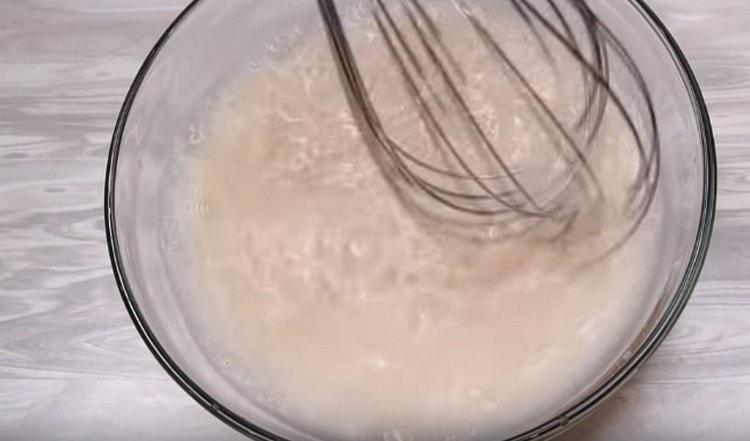 Dissolve yeast with sugar in water.