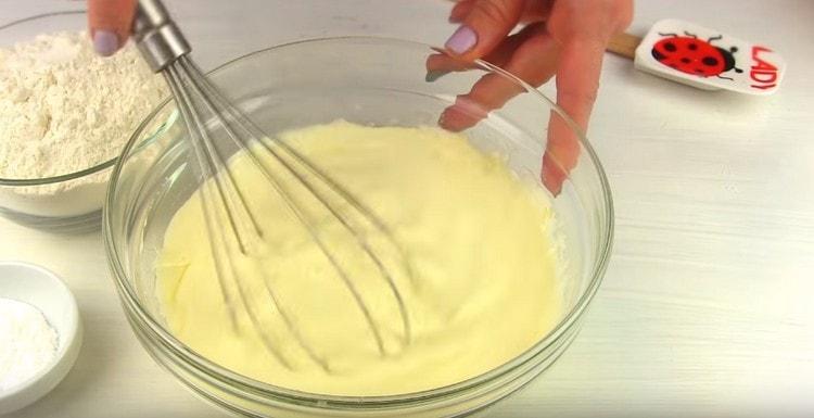 Mix the dough with a whisk.