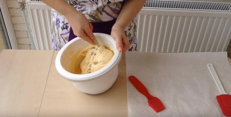 Add raisins to the dough and mix.