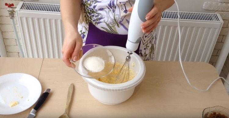 Immediately add vanilla sugar to the butter and beat it with a mixer.